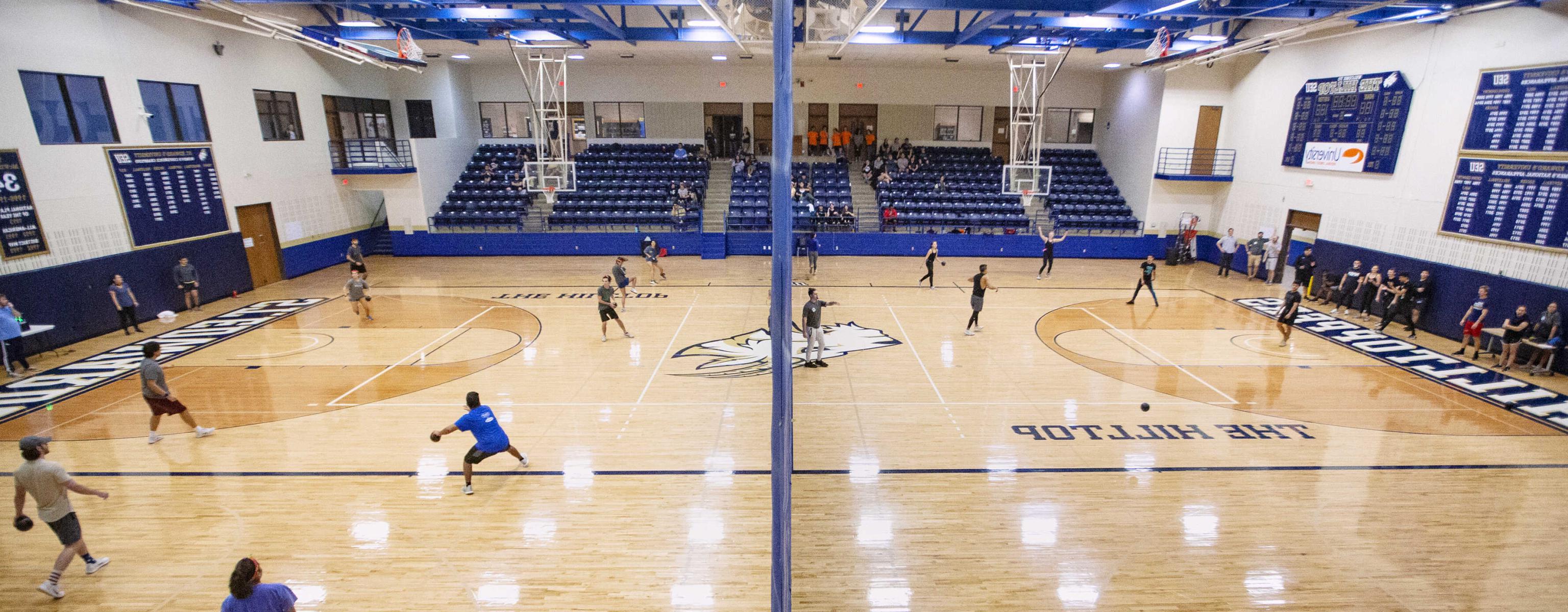 Playing dodgeball in the gym at St. Edward's University