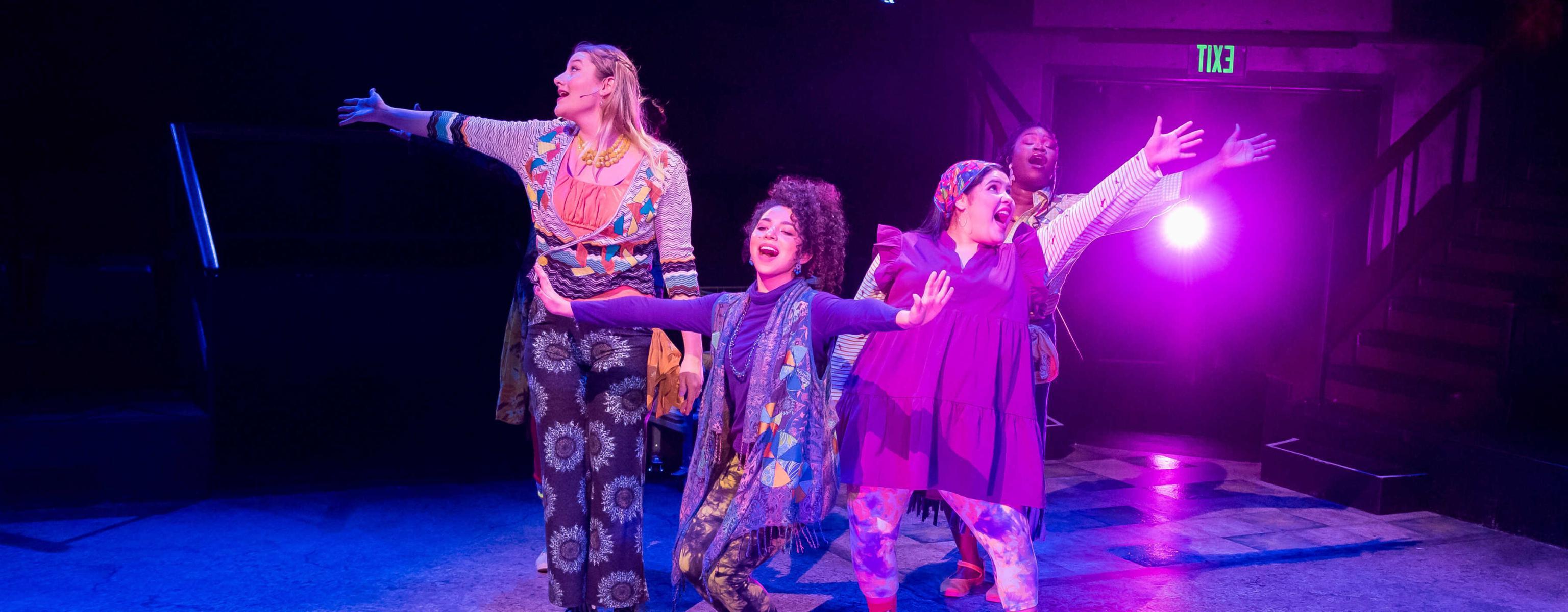 Students performing in a musical at the Mary Moody Northen Theatre at St. Edward's.