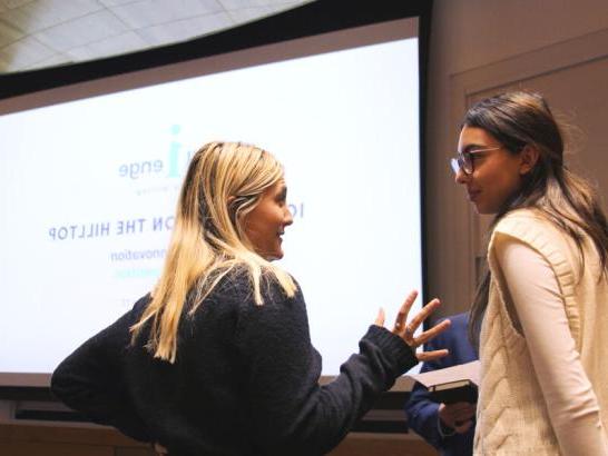 Students discuss their ideas at iChallenge on the Hilltop. 