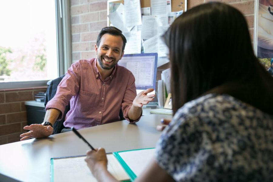 A friendly conversation between an academic advisor and a student